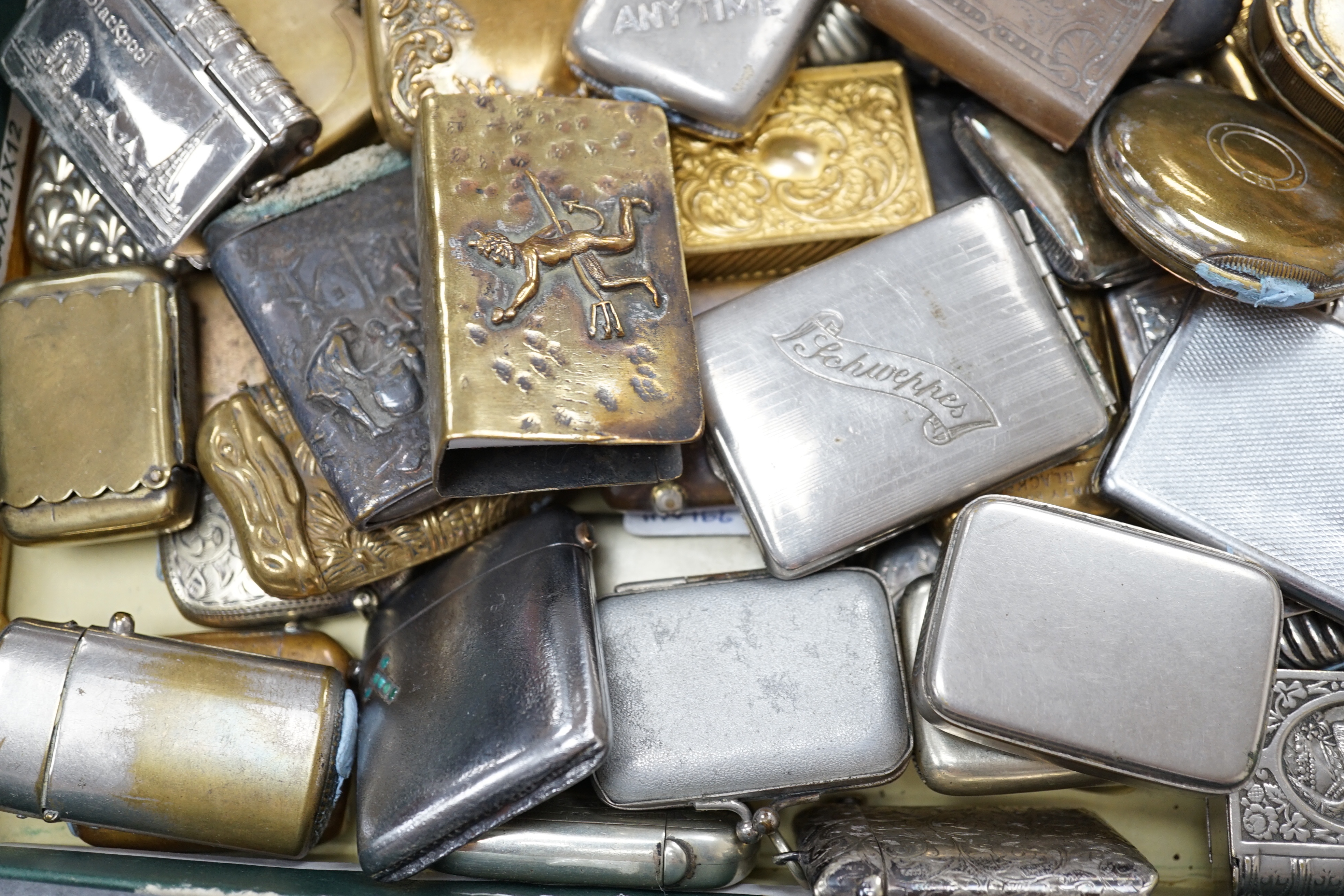 A large collection of mixed metal vestas including brass and copper